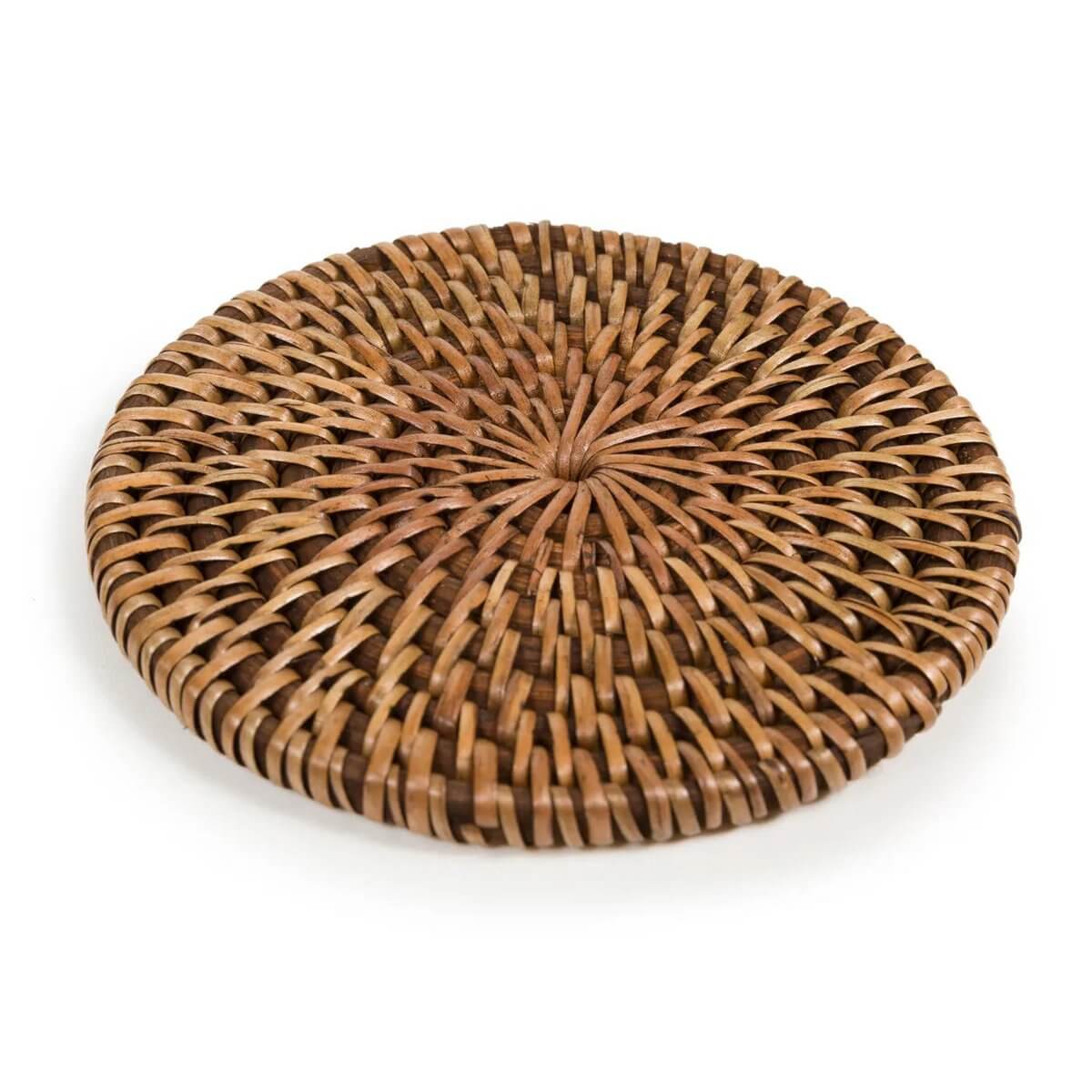 Handwoven bohemian rattan coaster in natural brown, perfect for adding island style to any table setting. 11cm wide from Bazar Bizar Living.