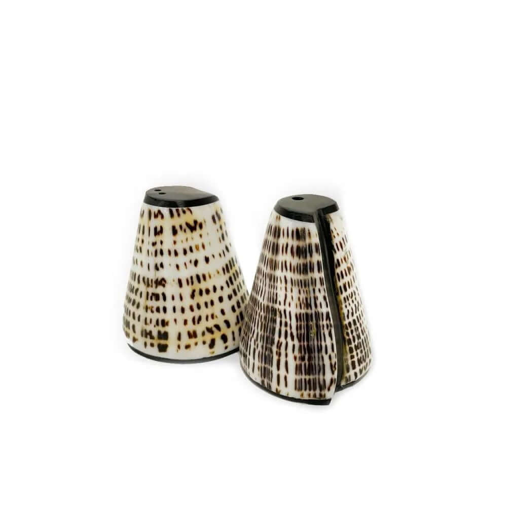 Bohemian style salt and pepper set made from handpicked shells with black details, featuring unique colors and patterns from Bazar Bizar Living.