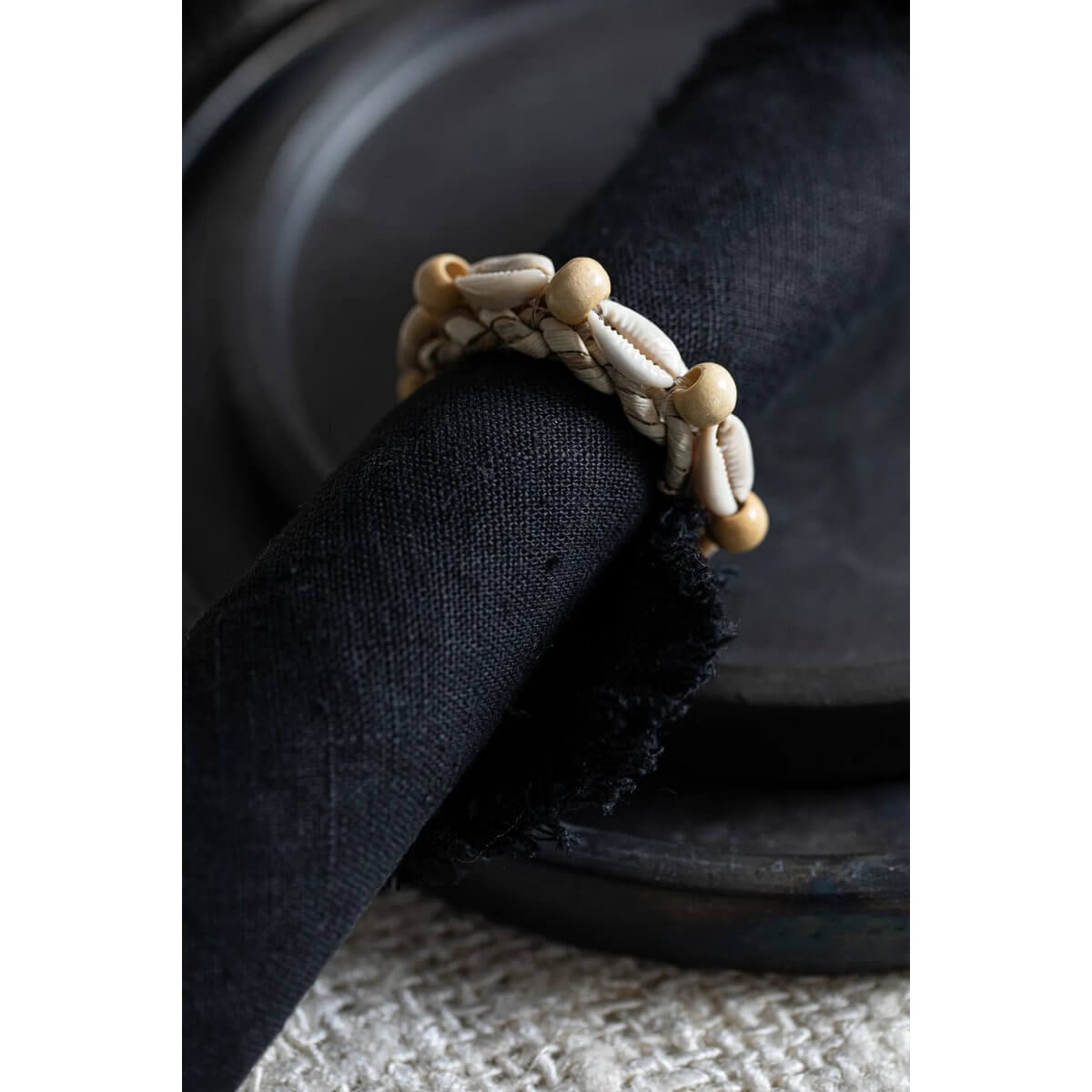 Bohemian coastal napkin ring adorned with shells from Bazar Bizar Living, perfect for an elegantly decorated table setting. Set of 4.