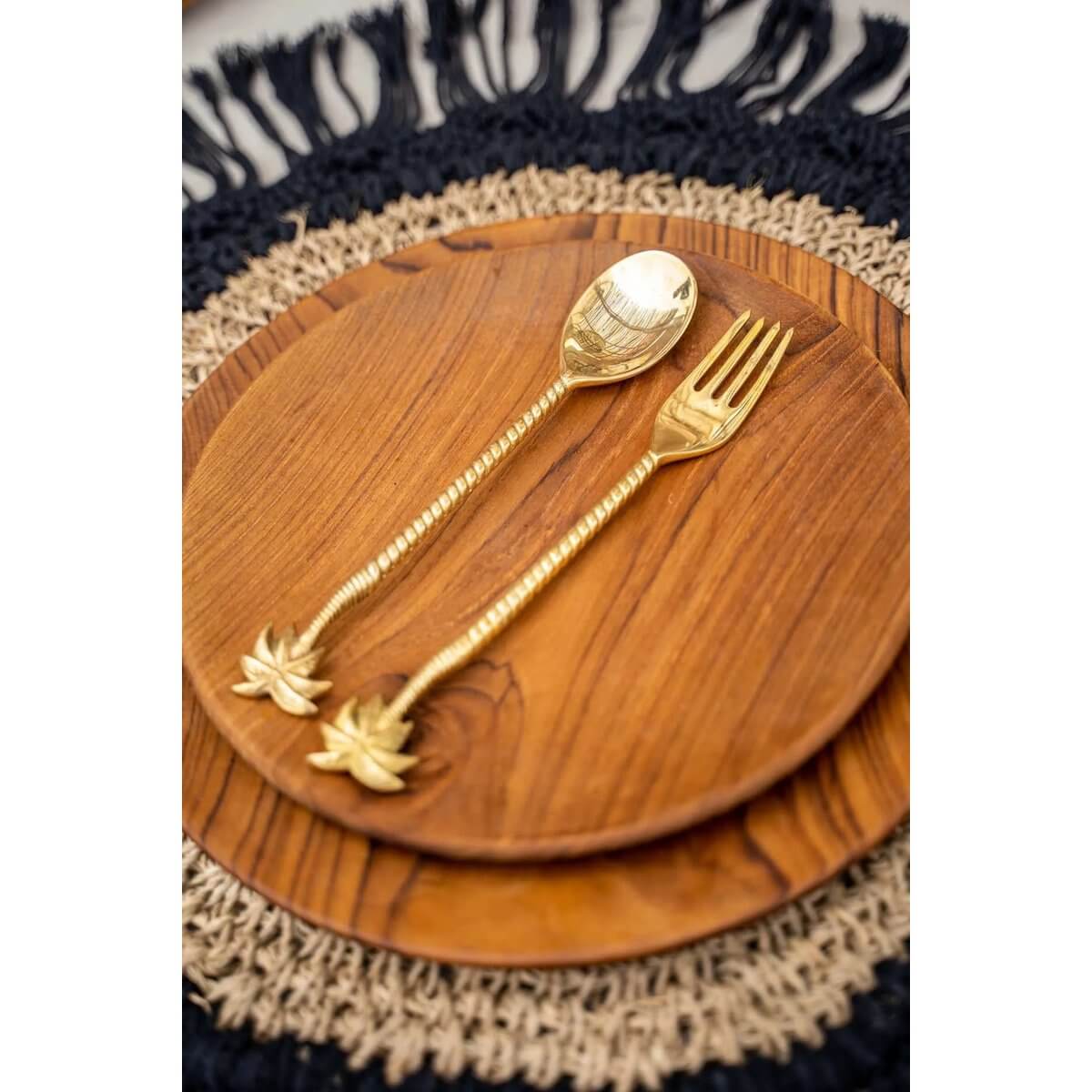 Bohemian-style teak root round plate with gold cutlery on a woven placemat, ideal for table decor or as a serving tray.