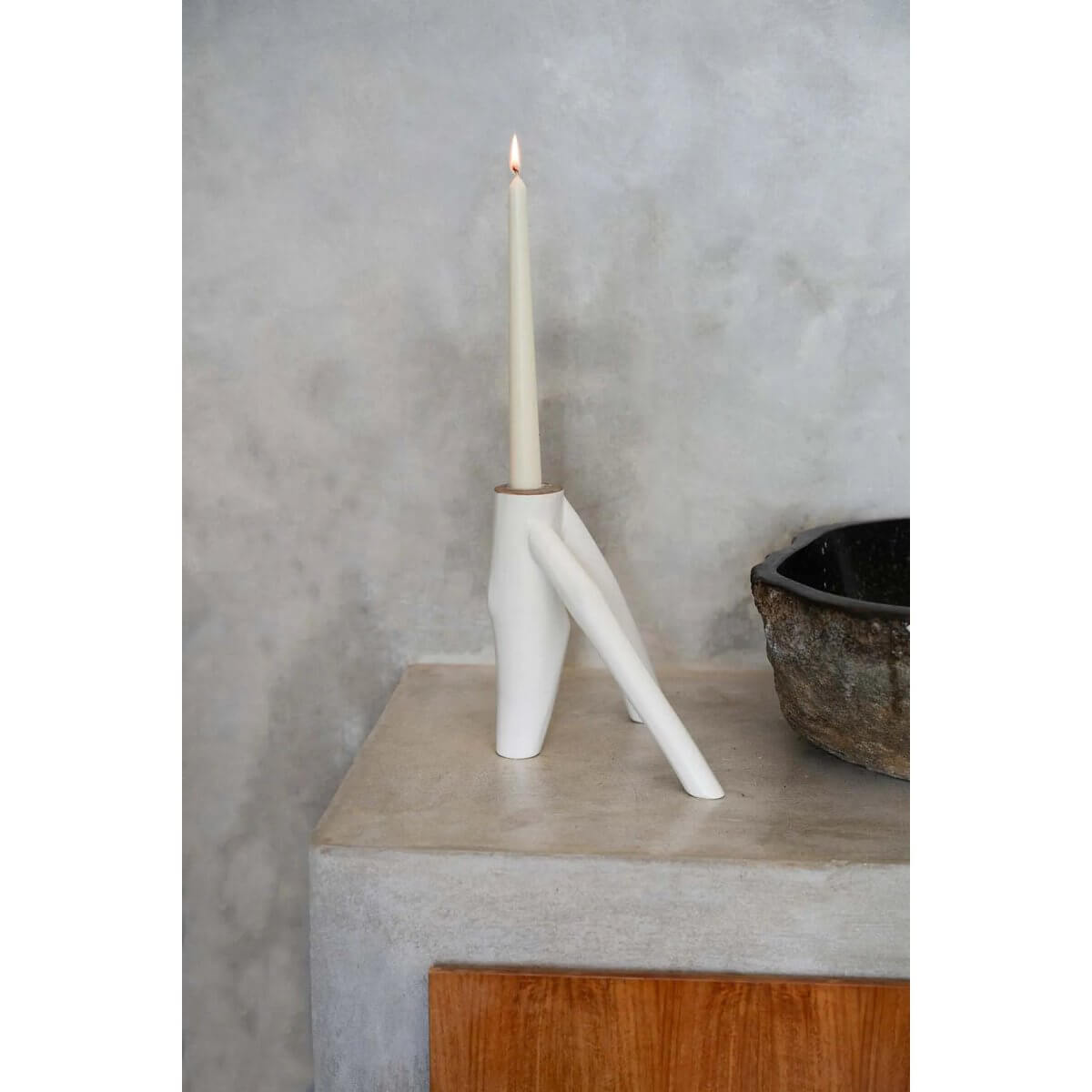 Elegant white Triple Twig Candle Holder with bohemian style, featuring a unique organic design resting on a minimalist concrete surface.